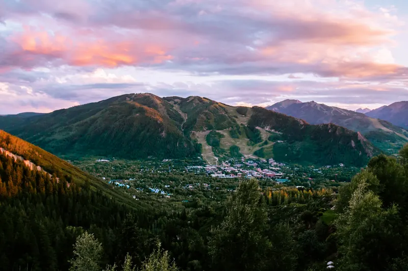 Aspen in its mountain valley at sunset